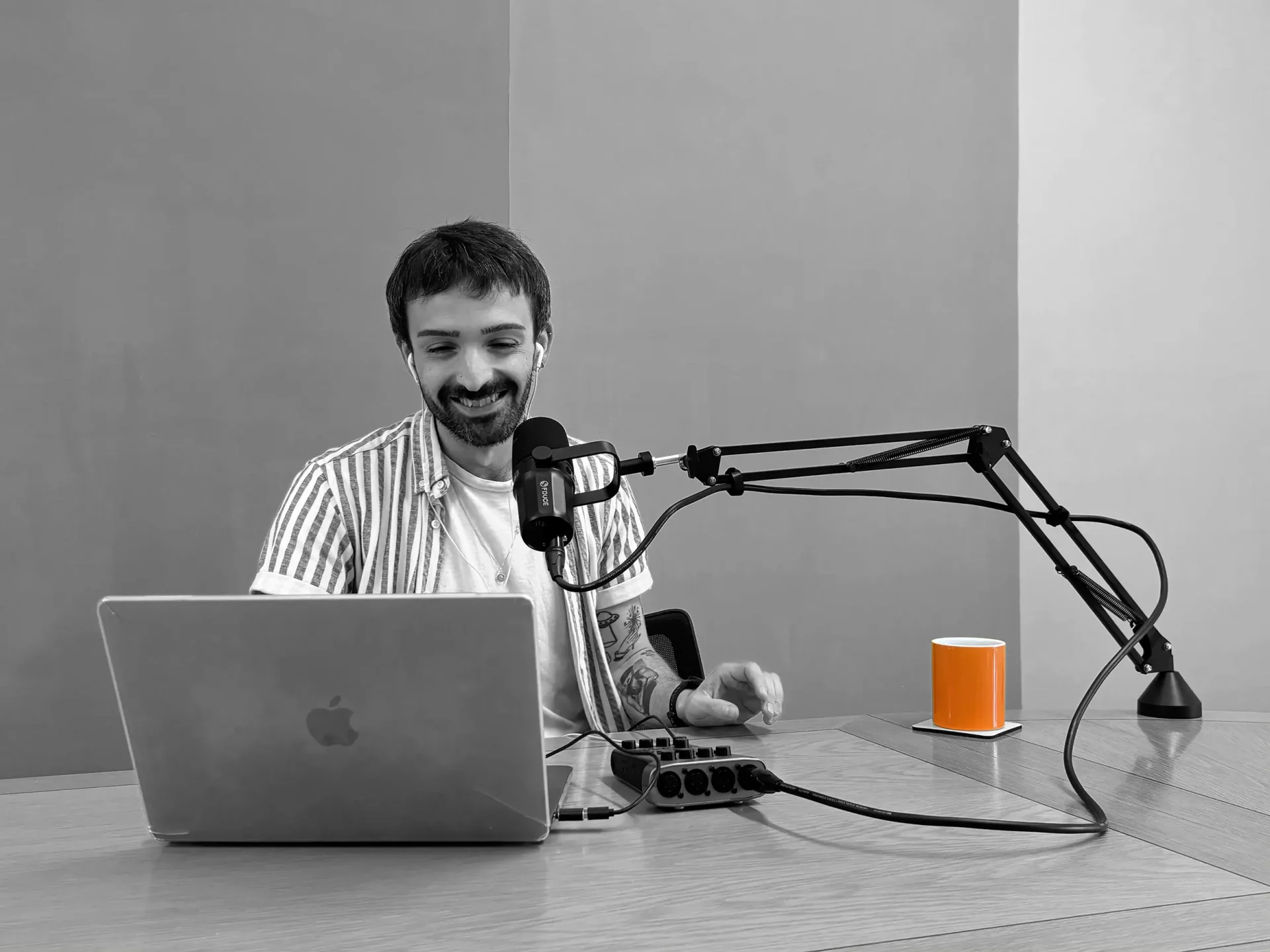 Lewis-podcasting-b+w Lewis podcasting
